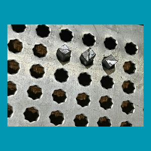 Algebra types inserted into Taylor Frame octagonal holes — accessible maths tool