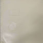 page of book with an embossed circle and rectangle
