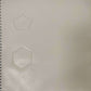 page from book with embossed pentagon and hexagon
