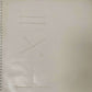 page from book with embossed lines and angles