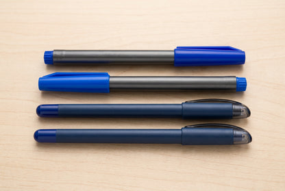 Four blue and black pens in the Bold Lines writing set: two Unomax Boldtron 2X writing pens and two Luxor Sign Pens