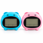 Blue and pink animal-shaped DT-1602-E talking digital table alarm clocks showing LCD screens on white background